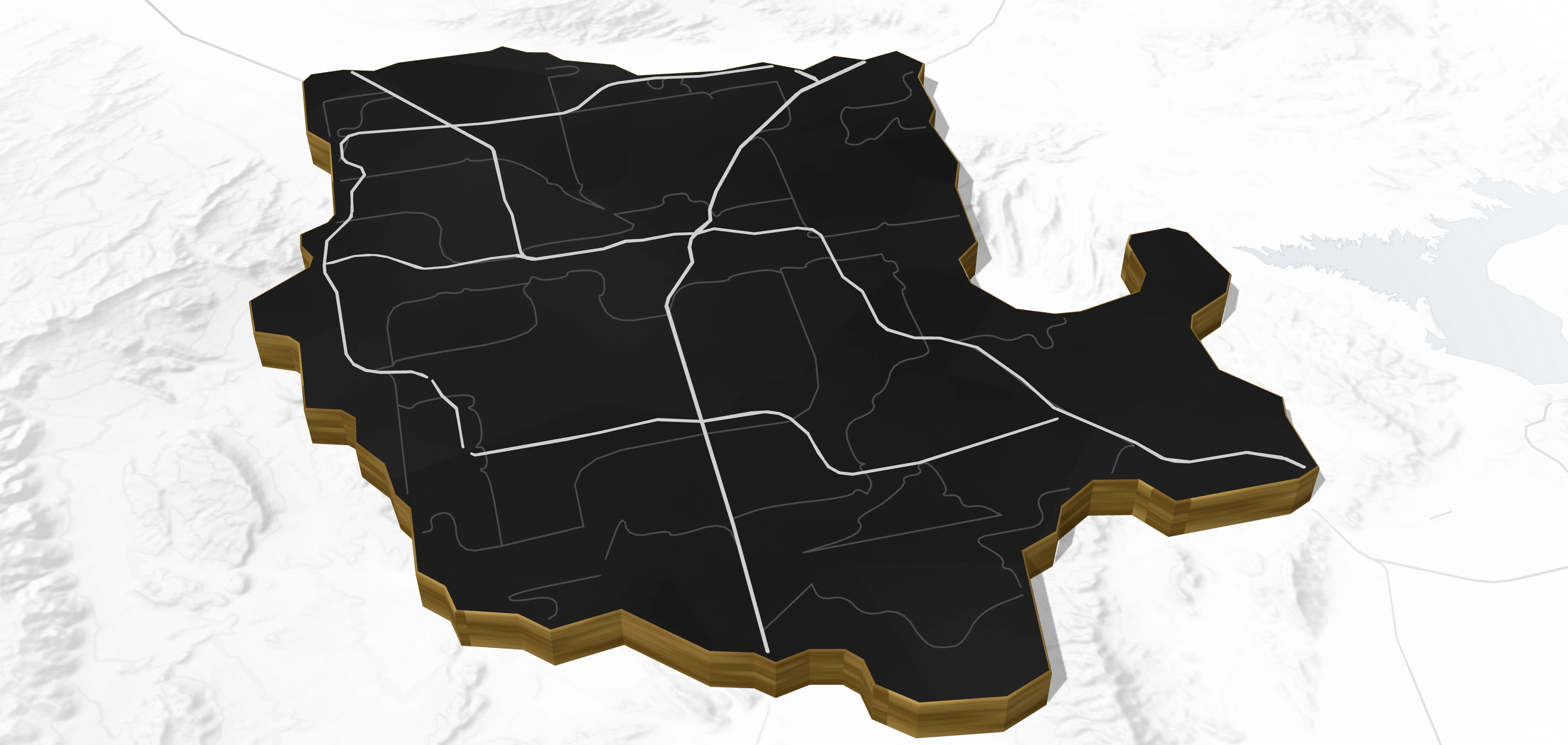 Stylized relief map of the Las Vegas Valley: a dark slab with gold edges, freeways and sixteen neighborhoods